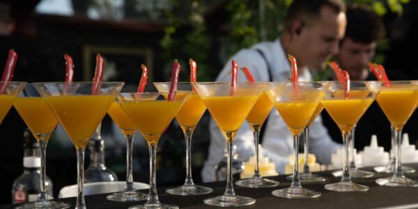 Sweet juicy tropical cocktails being served up with chillis at a corporate jungle themed event.