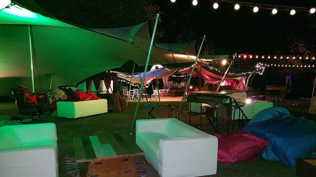 View of our festival themed event tents and chill out area in the evening.