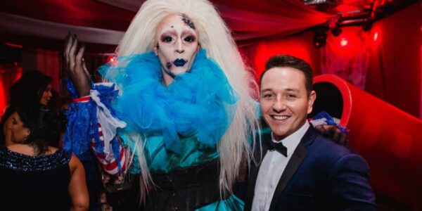 Guest-Posing-With-Drag-Queen-Performer