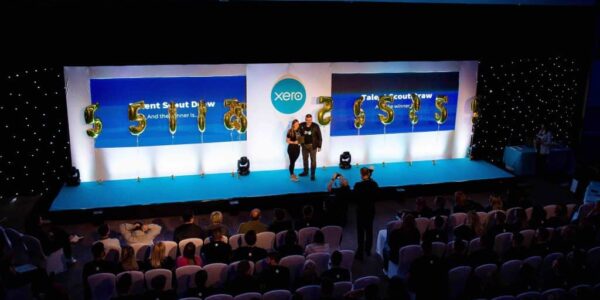 Delegate-With-Award-At-Conference