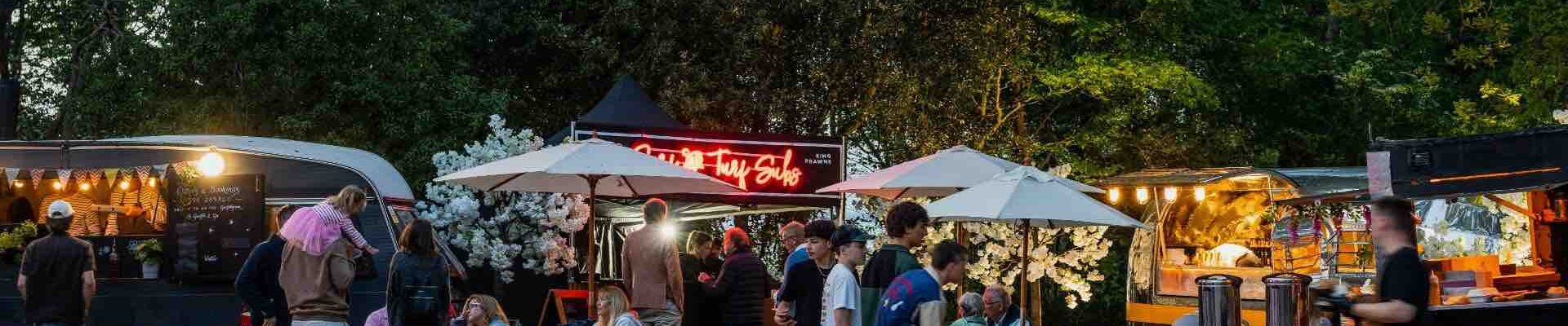 Festival-Guests-Ordering-At-Catering-Trucks