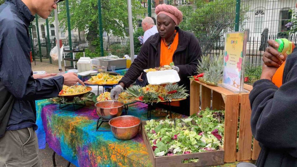Catering staff preparing food for guests attending event