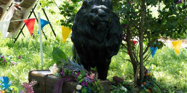 Floral black lion designed for an enchanted garden scene.