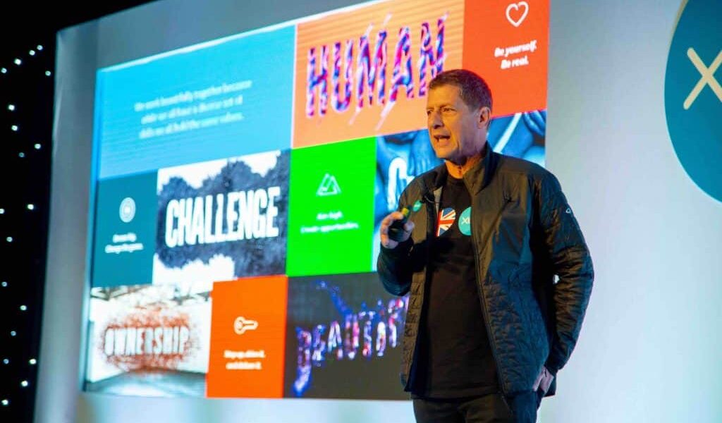 Man-On-Stage-Presenting-Company-Conference