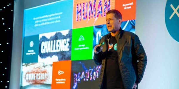 Man-On-Stage-Presenting-Company-Conference