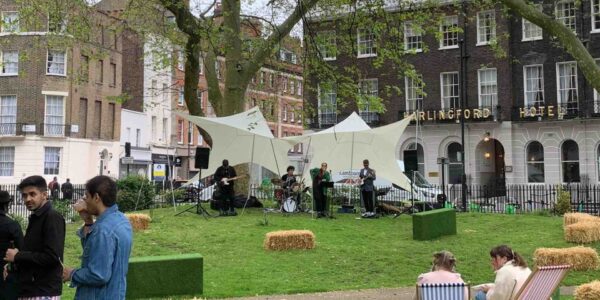 Outdoor-Festival-Setting-With-Band-Performing