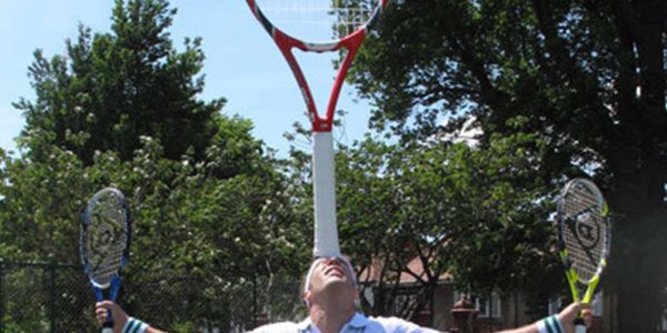 Comedy-Tennis-Player-Balancing-Rackets