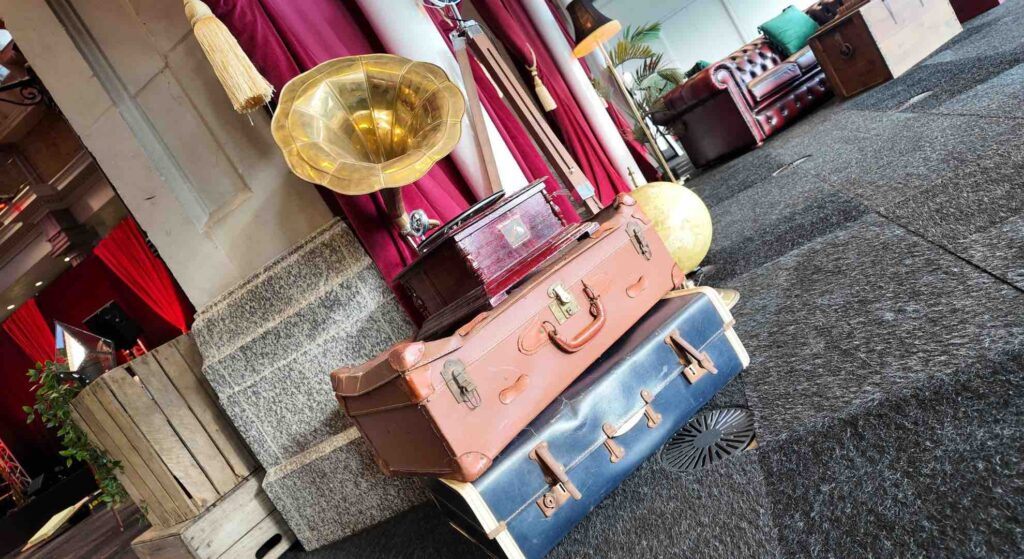 1920s party themed gramophone props on top of old briefcases at a 1920s themed event.