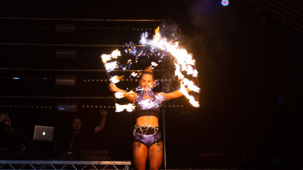 Beach party fire performer.