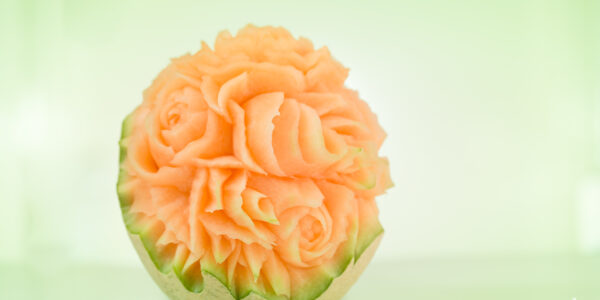 Intricate flower design carved into melon. Created by our virtual food carver.