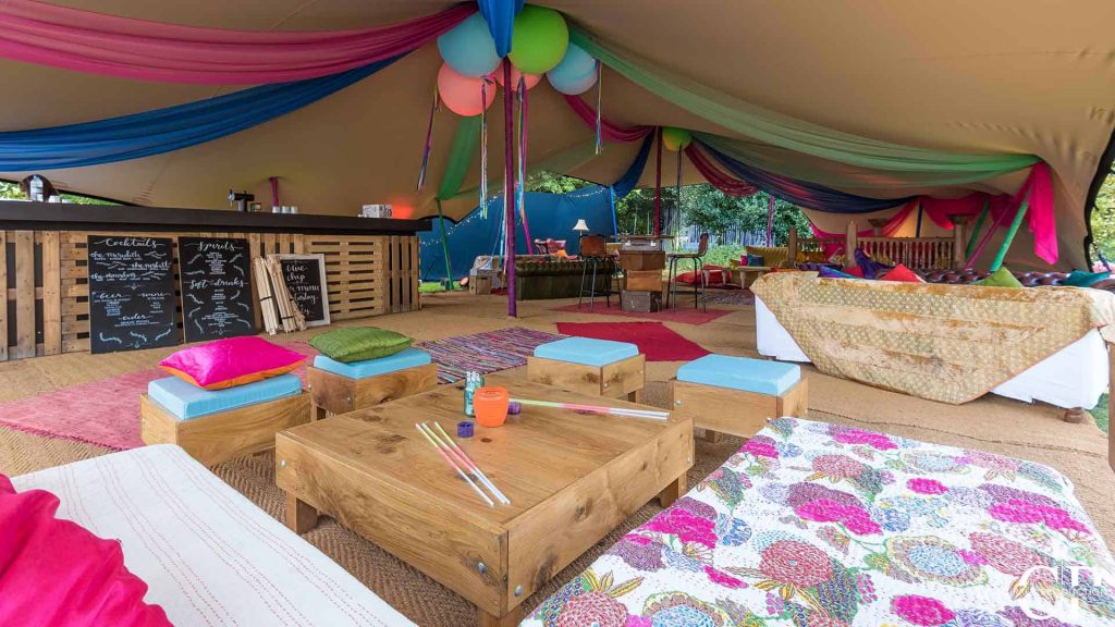 Colourful marquee decorated with festival themed decorations as part of Creative Event Theme at a corporate festival event