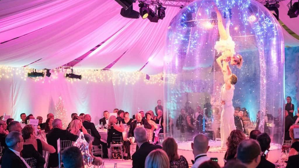 This human Snowglobe balancing act will set the right atmosphere for your festive event