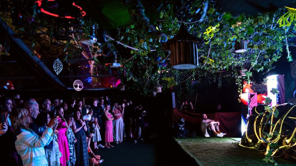 Enchanted Garden themed set and stage design creating a truly unique event space.