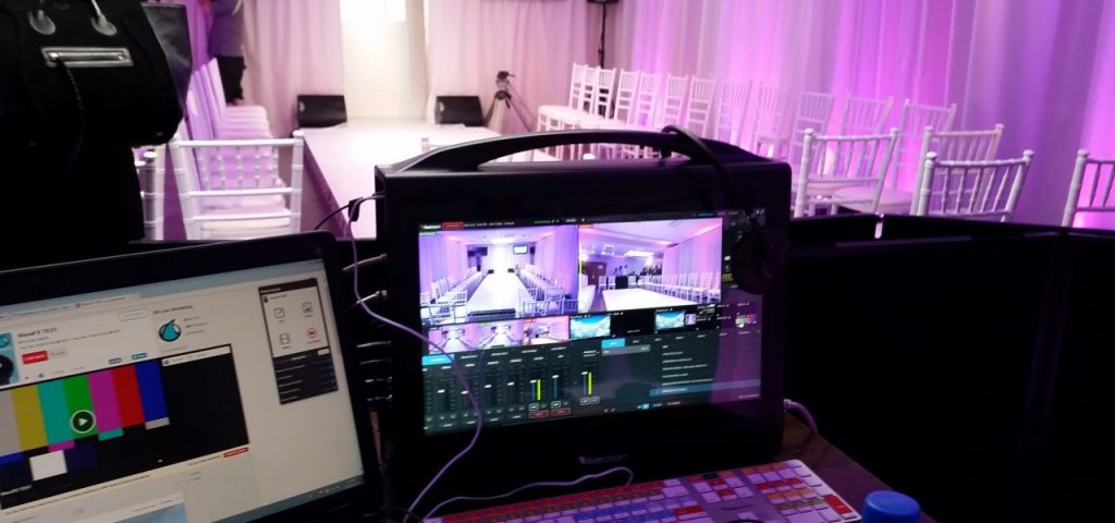 Our event management company tech team with live streaming equipment to capture a company fashion show. Part of our virtual conference management services where we can provide virtual streaming services for your company