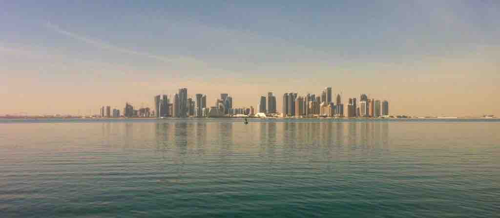 Doha capital city of Qatar skyline at sunrise.