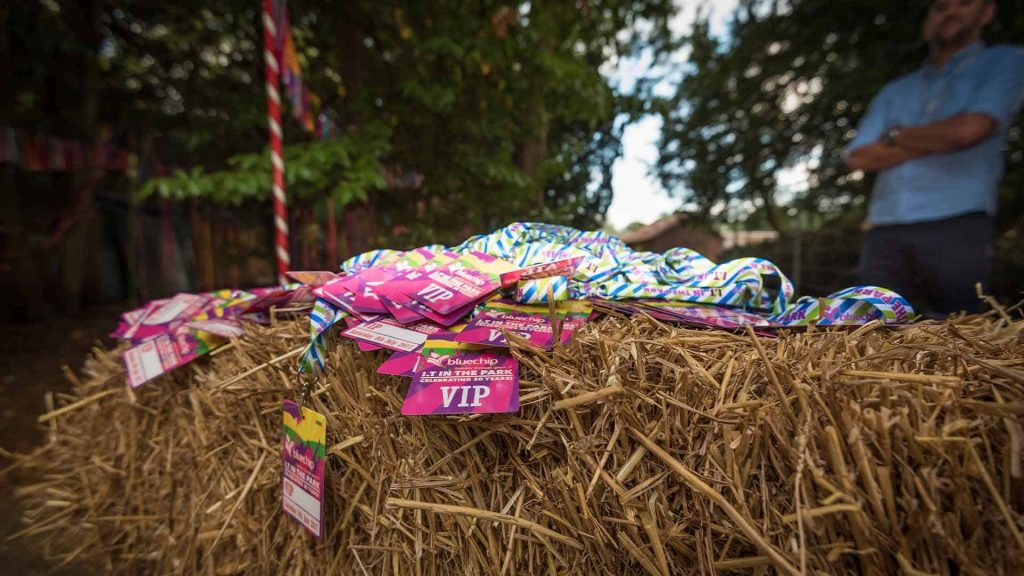 Event management company designing and creating bespoke lanyard invitations for festival event.