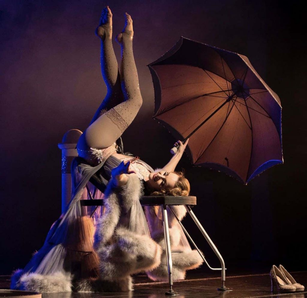 Marlene Dietrich Foot Juggling performer performing a stunning dance routine on stage in front of a LIVE audience. Available to book for events in the UK and Internationally.