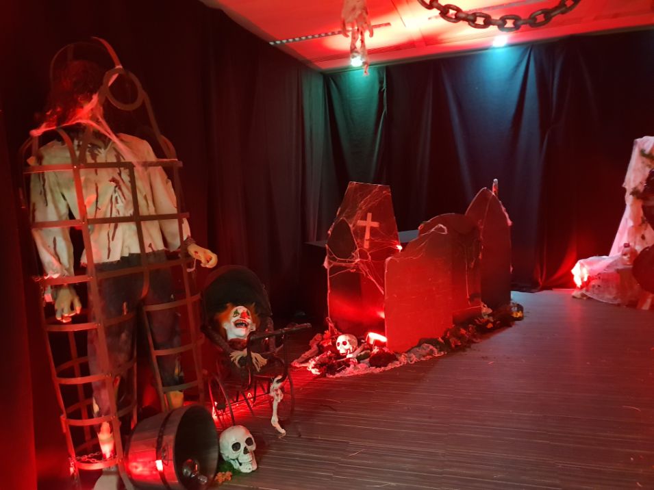 Office Space Halloween Theme transformation with a range of Halloween props and decorations.