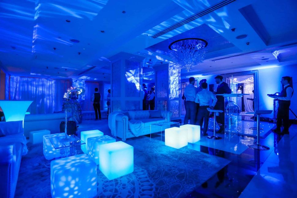 Winter Wonderland themed event space with LED seating cubes, lighting projections and more.