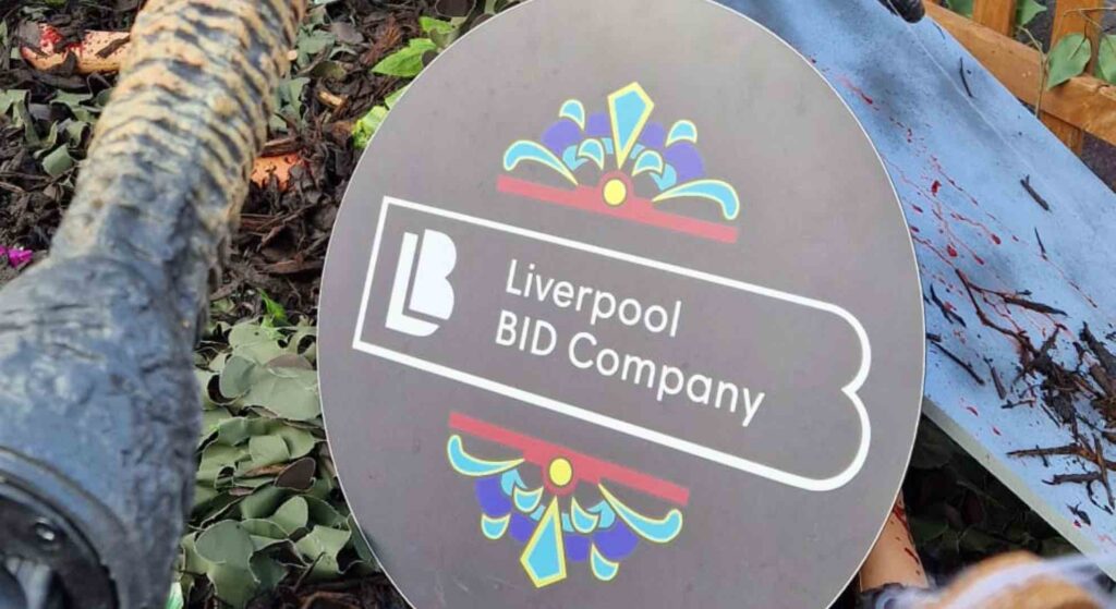 Liverpool BID company sign at a Halloween community activation.