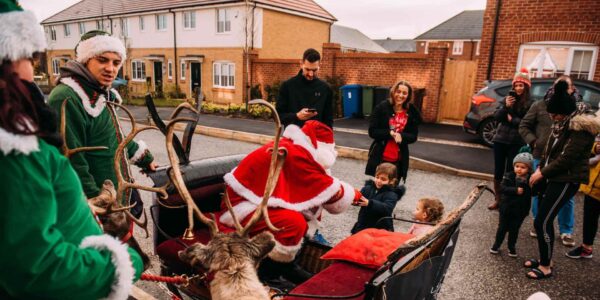 Santa-Claus-Handing-Out-Presents