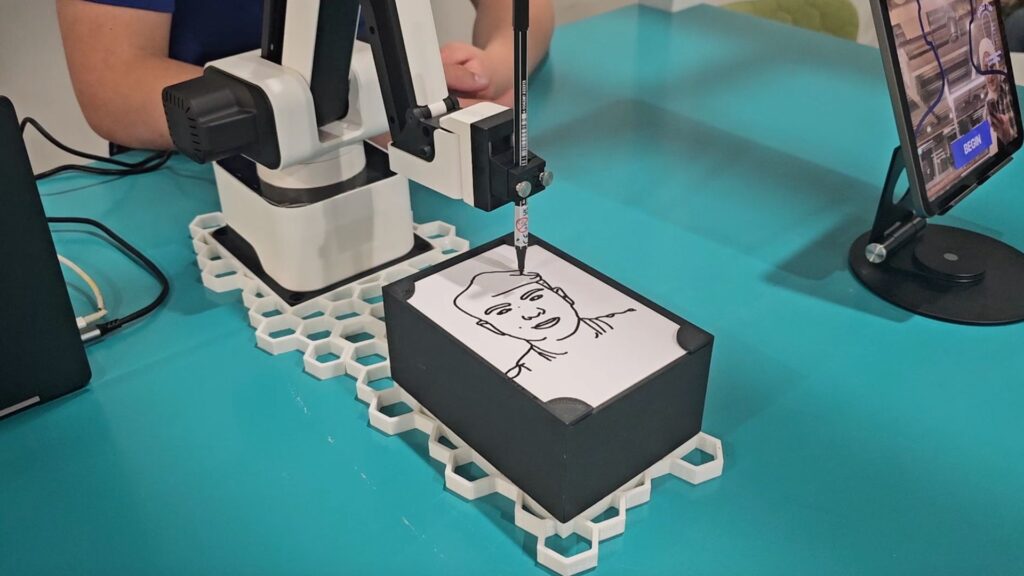 Ai robot sketch bot that draws line portraits of exhibition guests.