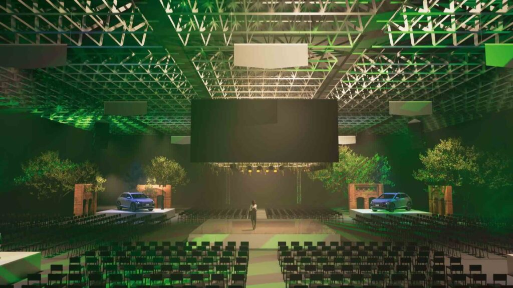 Bespoke conference design rendered by the Julia Charles Event Management team showing seating, large LED screen and eco theming.