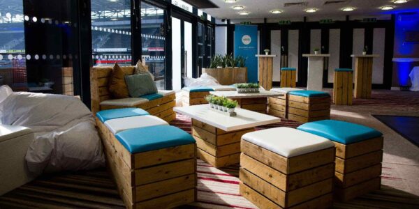 Break out area with pallet wood furniture designed in brand colours of XERO.