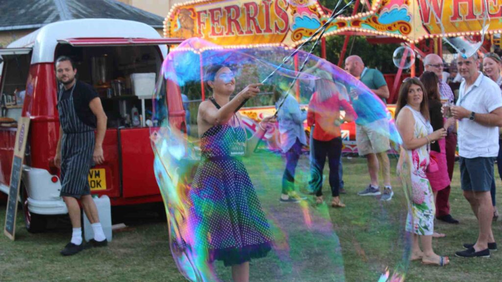 Bubble performer at a carnival style festival fun day.