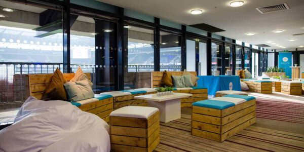 Sustainable pallet furniture break out room with XERO branded colours and bright colours.