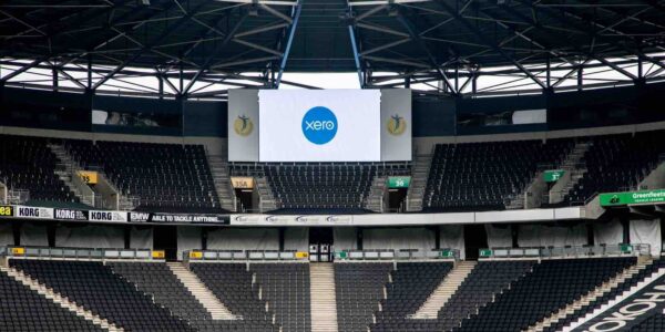 LED screens displaying XERO signage at MK Stadium as part of the branding highlights of this corporate company conference held at this venue.