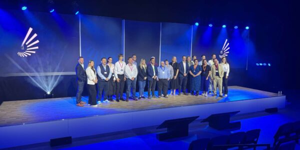 Conference audience on stage at an event produced and managed by our team.