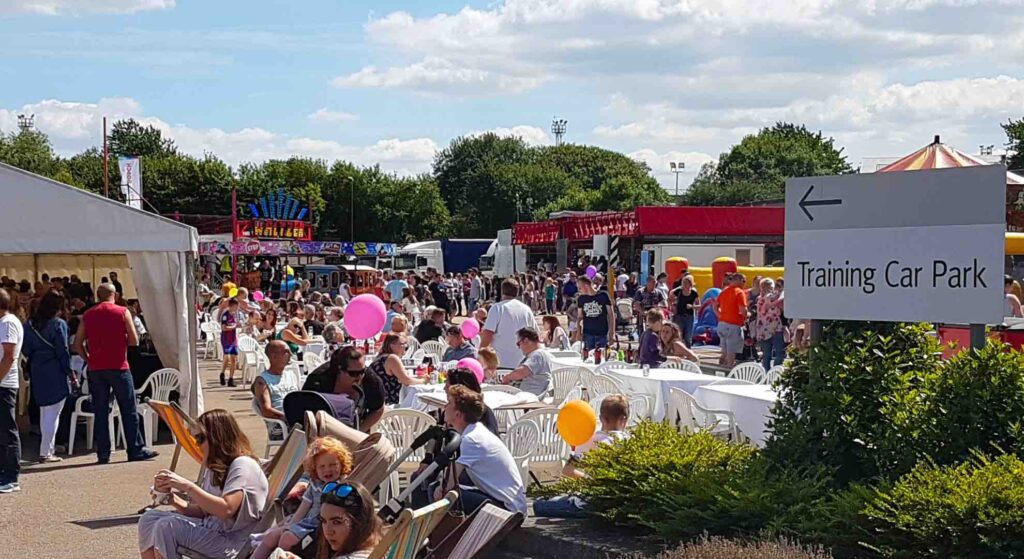 Company family fun day set up in a car park.