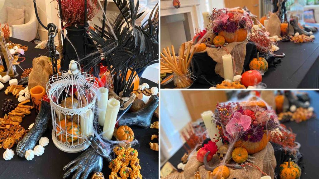 Elegant floral arrangements inside pumpkins, paired with glowing candles and decorative cages, creating a spooky yet stylish Halloween table setting.