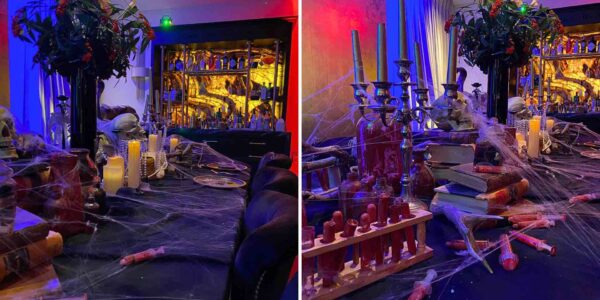 Spooky table display with Halloween props like syringes, floral arrangements, skeletons, and candles, crafted as part of a home decoration service.