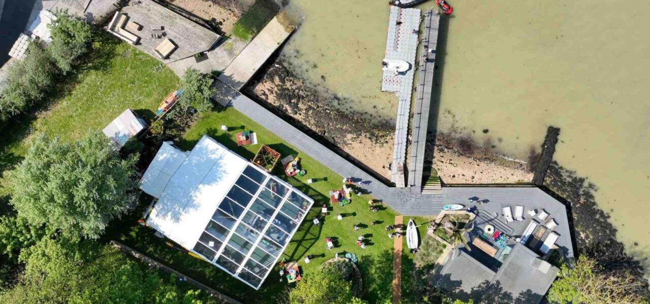 Event managed by Julia Charles on the Isle of Wight showing aerial drone shot of marquee and harbour.