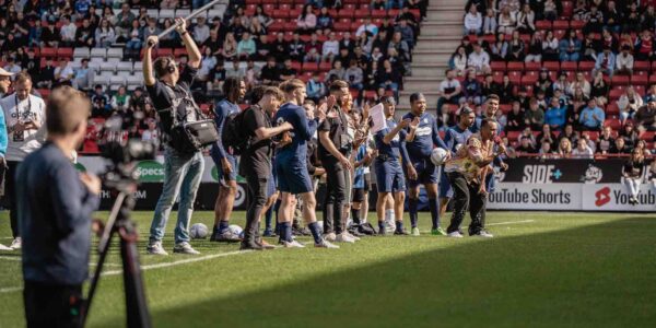 Fans-On-Pitch-At-Football-Event