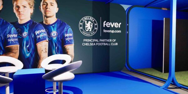 Branded fan park installation design with blue decor and white seating.