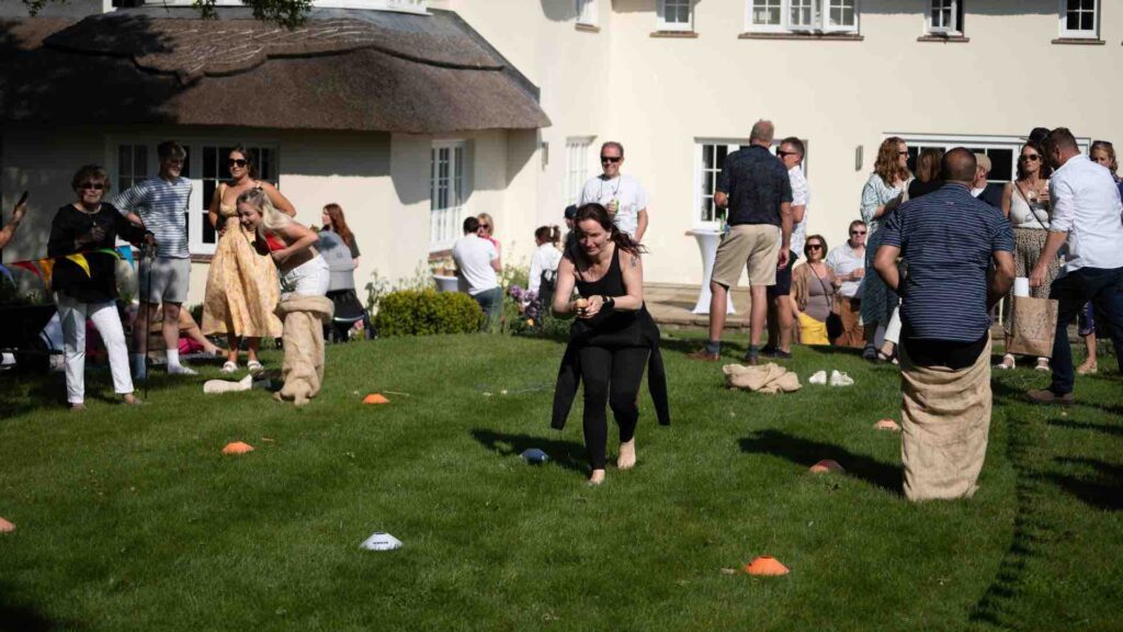 Adult sports day activities being played by guests at event