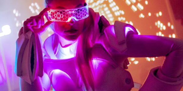 Vibrant LED robot dancers performing at a company fun day on Magna Carta Island, London.