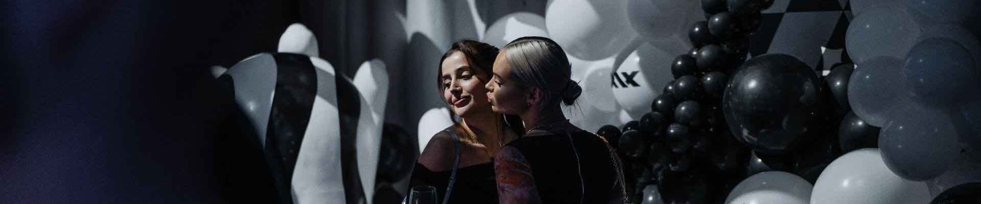 Guests-Posing-With-Photo-Installation-At-Launch-Event