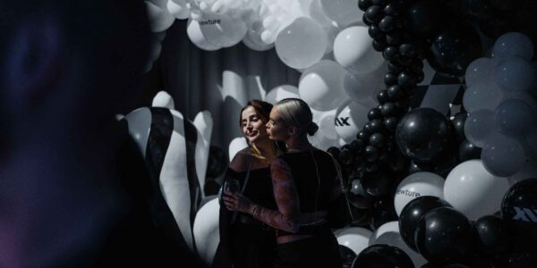 Guests-Posing-With-Photo-Installation-At-Launch-Event
