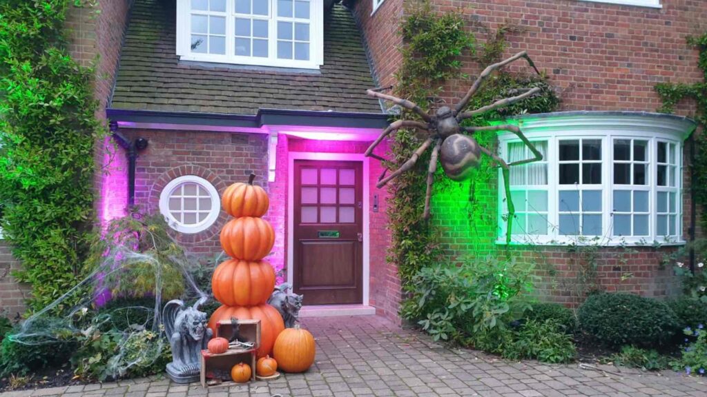 Giant spider and pumpkin decor for halloween house dressing on hampstead heath.