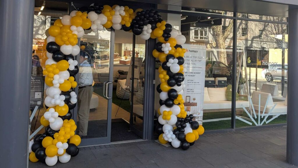 Homary UK store launch in Chiswick London with balloon arch in brand colours.