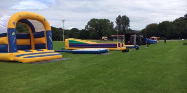 Inflatables-Set-Out-On-Grass-For-Event