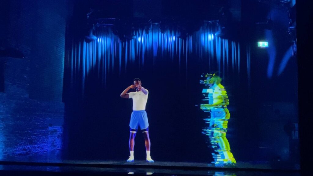 A hologram of a football player performing with a live player for an Under Armour product launch event designed by London based company.