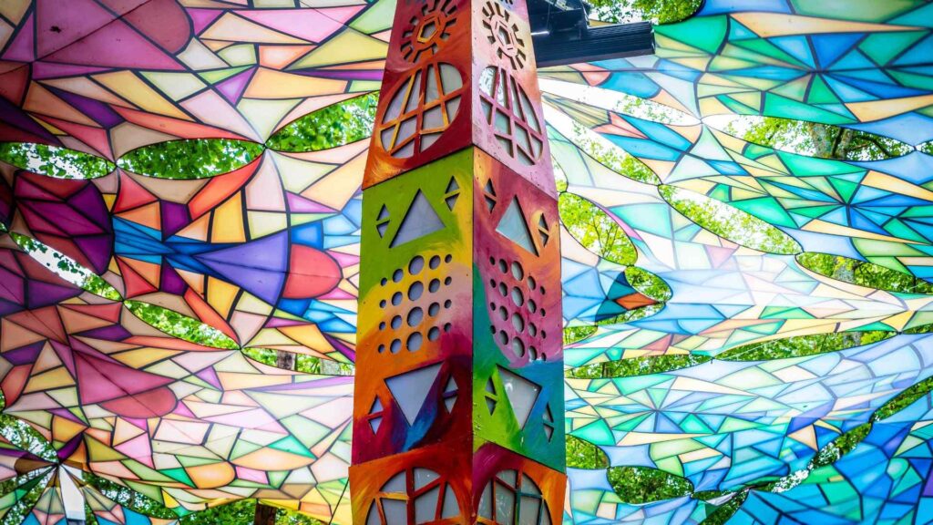 Bright multi-coloured outdoor ceiling canopy and tiki tower.
