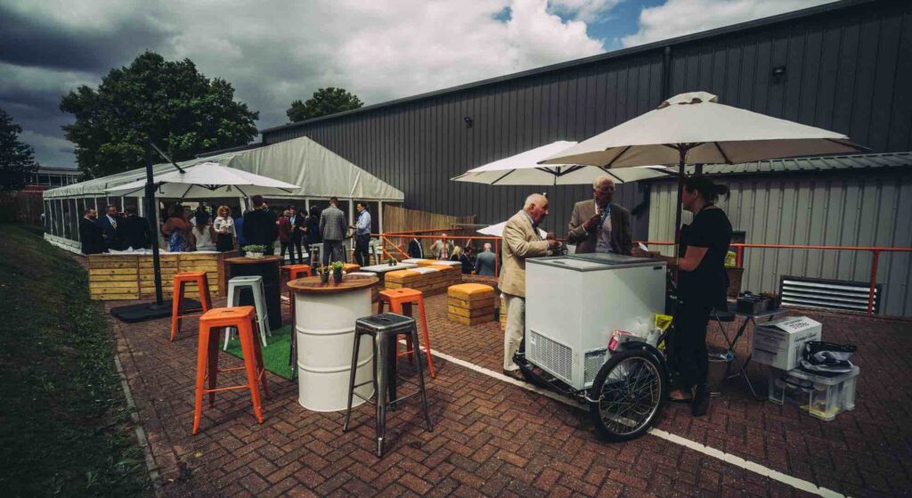Catering carts, reusable furniture and marquee set up at rotable repair event.