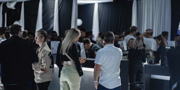 People-Conversing-At-Product-Launch