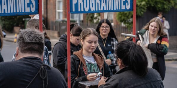 Programme-Stand-At-Fan-Zone-Event